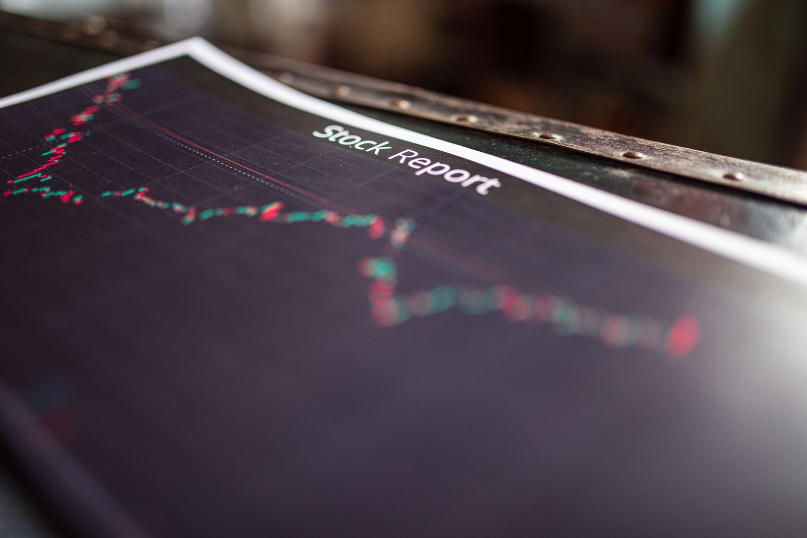 Printed stock report showing a verified month-by-month performance chart