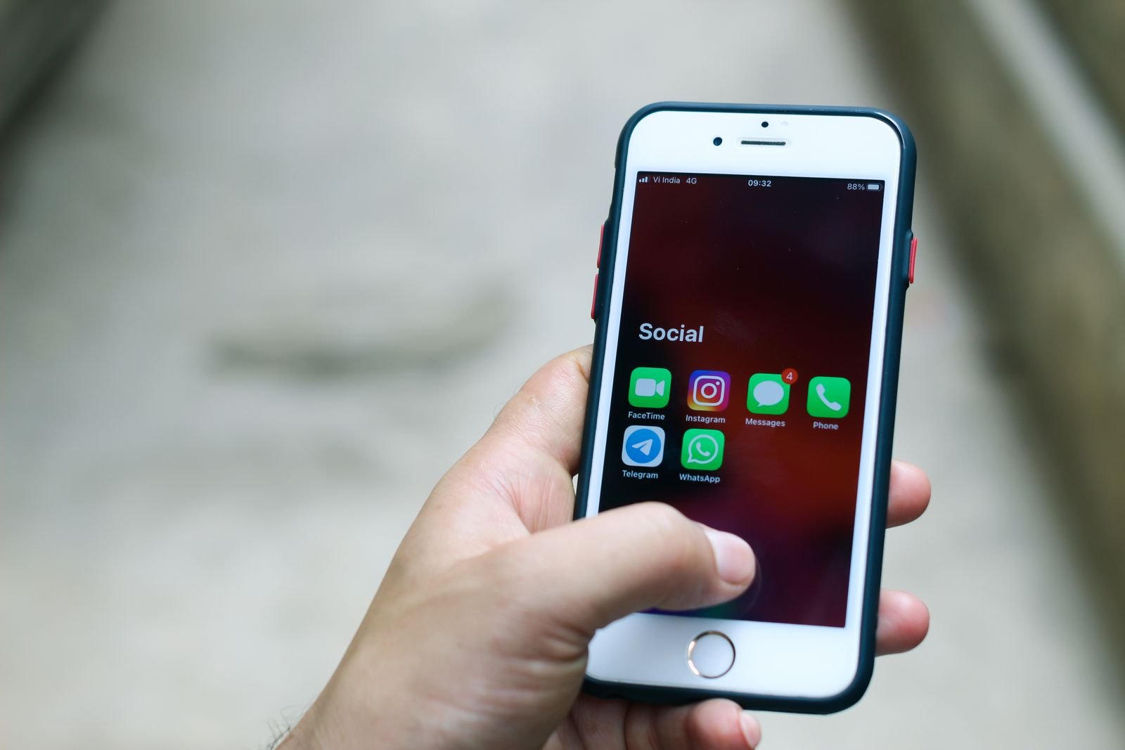 Trader checking a phone for the live forex signal alert sent to Telegram